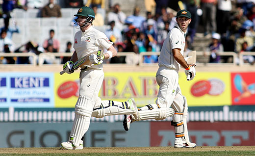 Steve Smith and Glenn Maxwell of Australia in action during the first day of the third cricket test match between India and Australia