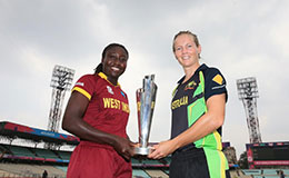 Stafanie Taylor L and Meg Lanning R with the ICC WWT20 trophy