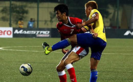 Bengaluru FCs Kim Song Yong vies for possession with Mumbai FC defender Minchol Son at the Cooperage Stadium