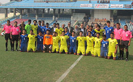 Bengaluru FC and Lonestar Kashmir FC players and officials pose for a group photograph at the Ambedkar Stadium