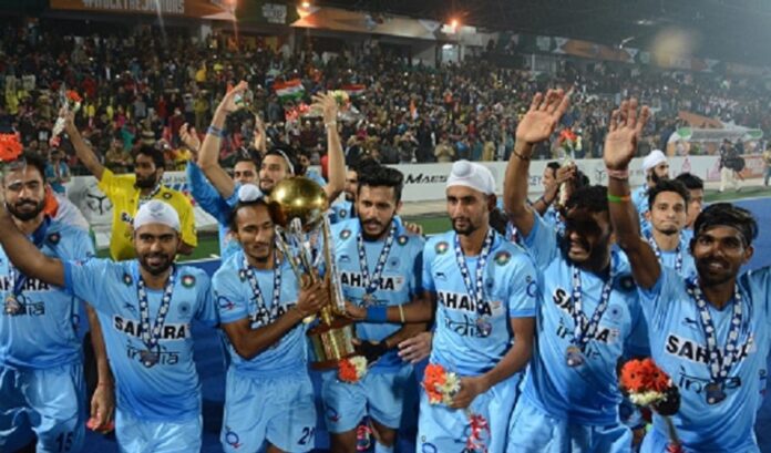 India junior hockey captain Harjeet Singh holding the Junior World Cup trophy