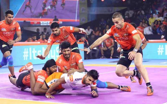 U Mumba defenders showcase their defence skills against Puneri Paltan raider Pawan Kumar U Mumba defenders showcase their defence skills against Puneri Paltan raider Pawan Kumar