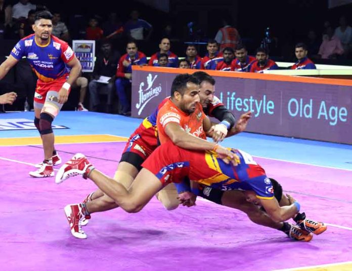 Sandeep Narwal being tackled by UP Yoddha