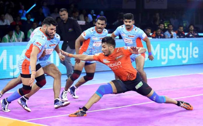 Arjun Deshwal of U Mumba tries to raid past the strong defence of Bengal Warriors Arjun Deshwal of U Mumba tries to raid past the strong defence of Bengal Warriors