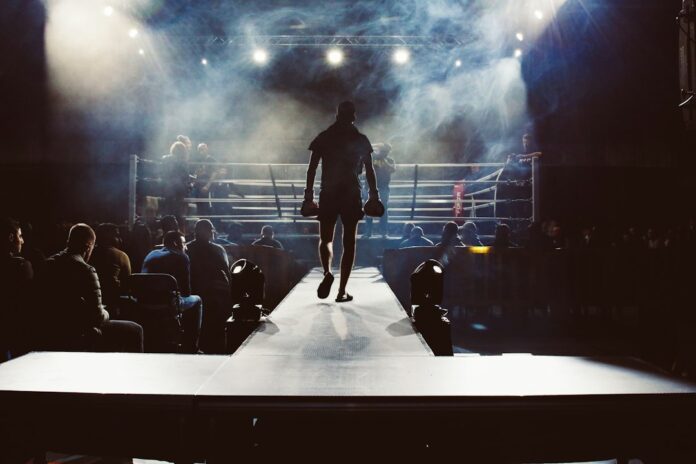 Boxing ring under arena lights Boxing ring under arena lights