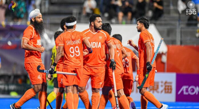India men's hockey team celebrate Asian Games 2026 gold against Malaysia India men's hockey team players, including Shilanand Lakra and captain Harmanpreet Singh, celebrate a goal against Malaysia in the Asian Games 2026 hockey final
