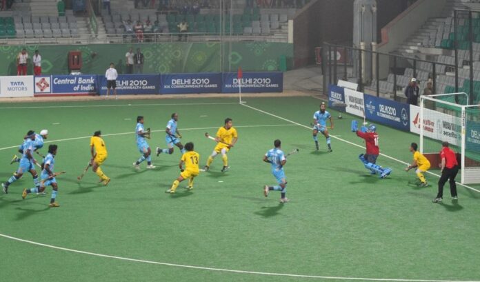 India and Malaysia players during a hockey match at the Major Dhyan Chand National Stadium at the 2010 Commonwealth Games