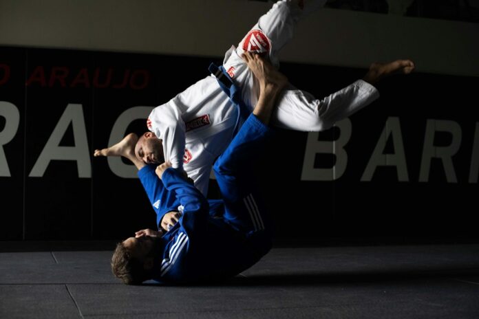 Two judokas competing on a judo mat