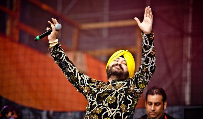 Punjabi pop singer Daler Mehndi performing on stage Punjabi pop singer Daler Mehndi performing on stage