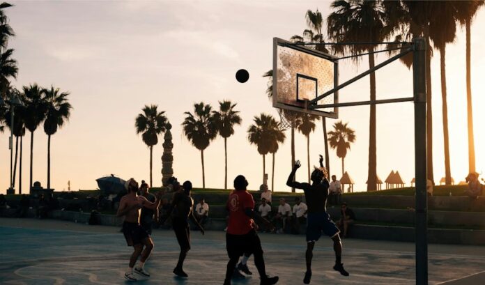 Young basketball players competing for the ball on an outdoor court